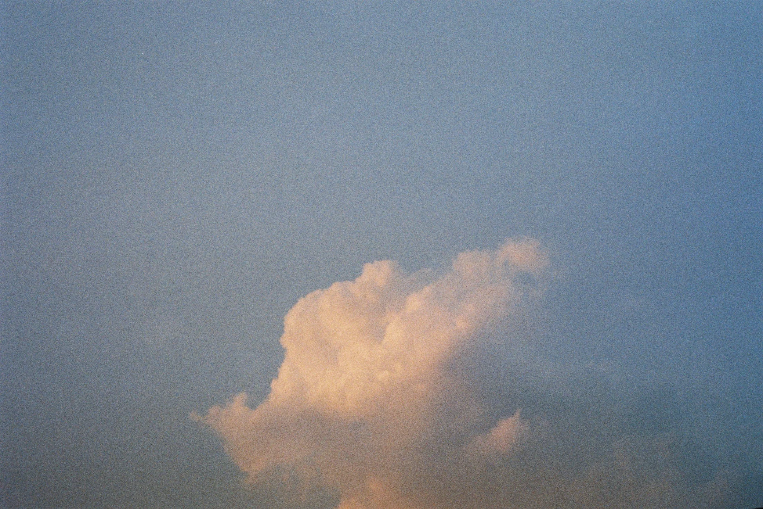 Sky with soft pink and white clouds