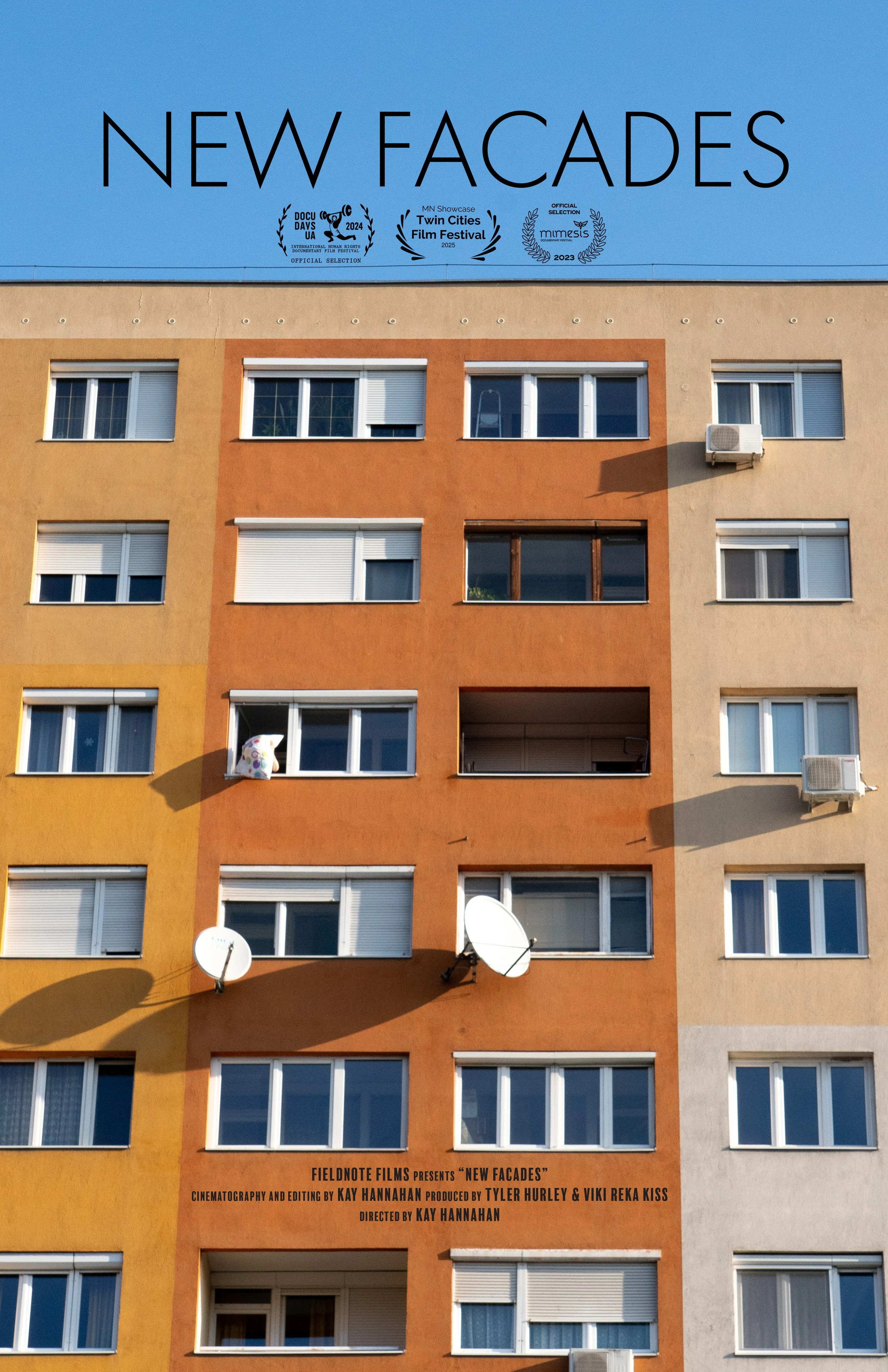 Poster for the documentary film 'New Facades' showing a multicolored apartment building with several satellite dishes and air conditioning units on the facade. The poster includes film festival laurels for Docu Days UA, Twin Cities Film Festival, and Mimas; credits for the filmmakers, and the title 'New Facades' at the top.