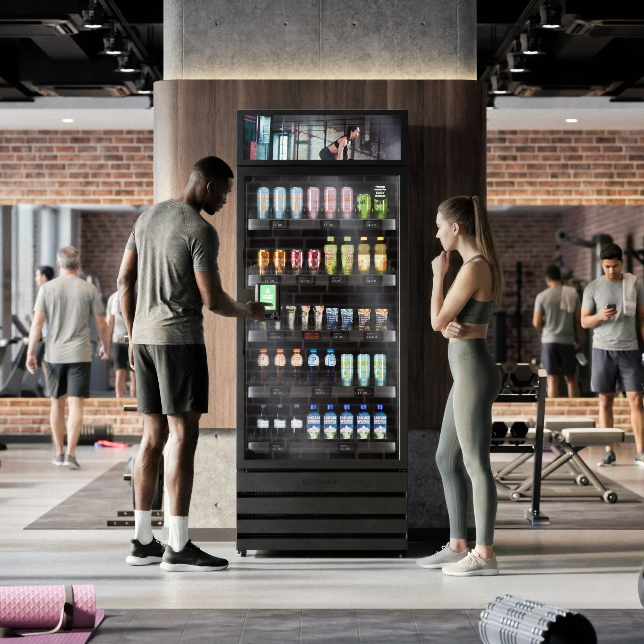 Employees using a modern vending machine in a gym break area in Princeton, NJ