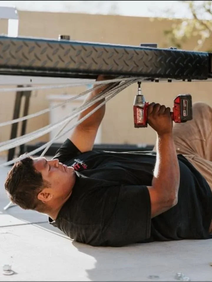 Automotive lift Installation technician installing a vehicle lift in Arizona