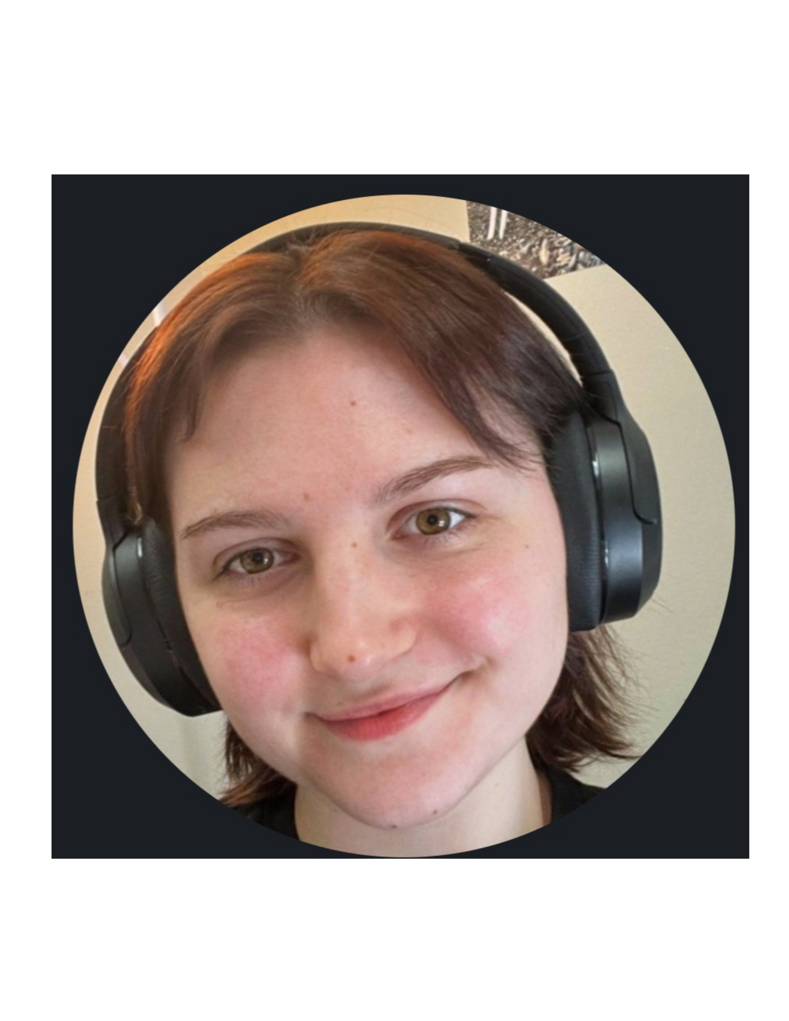 Close-up of a young person with brown hair wearing large over-ear headphones, smiling slightly.