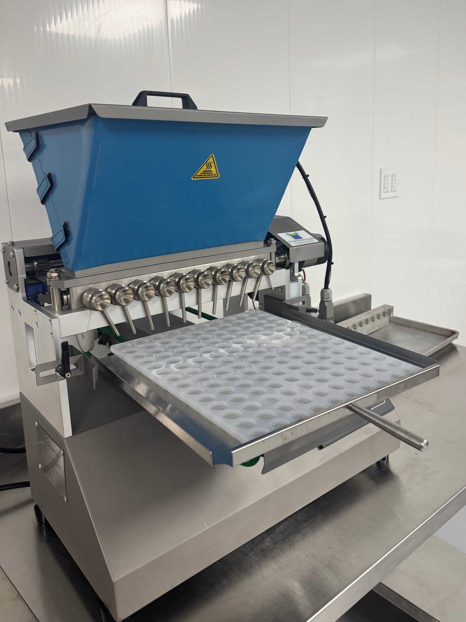 Gummy depositor in the AFG facility