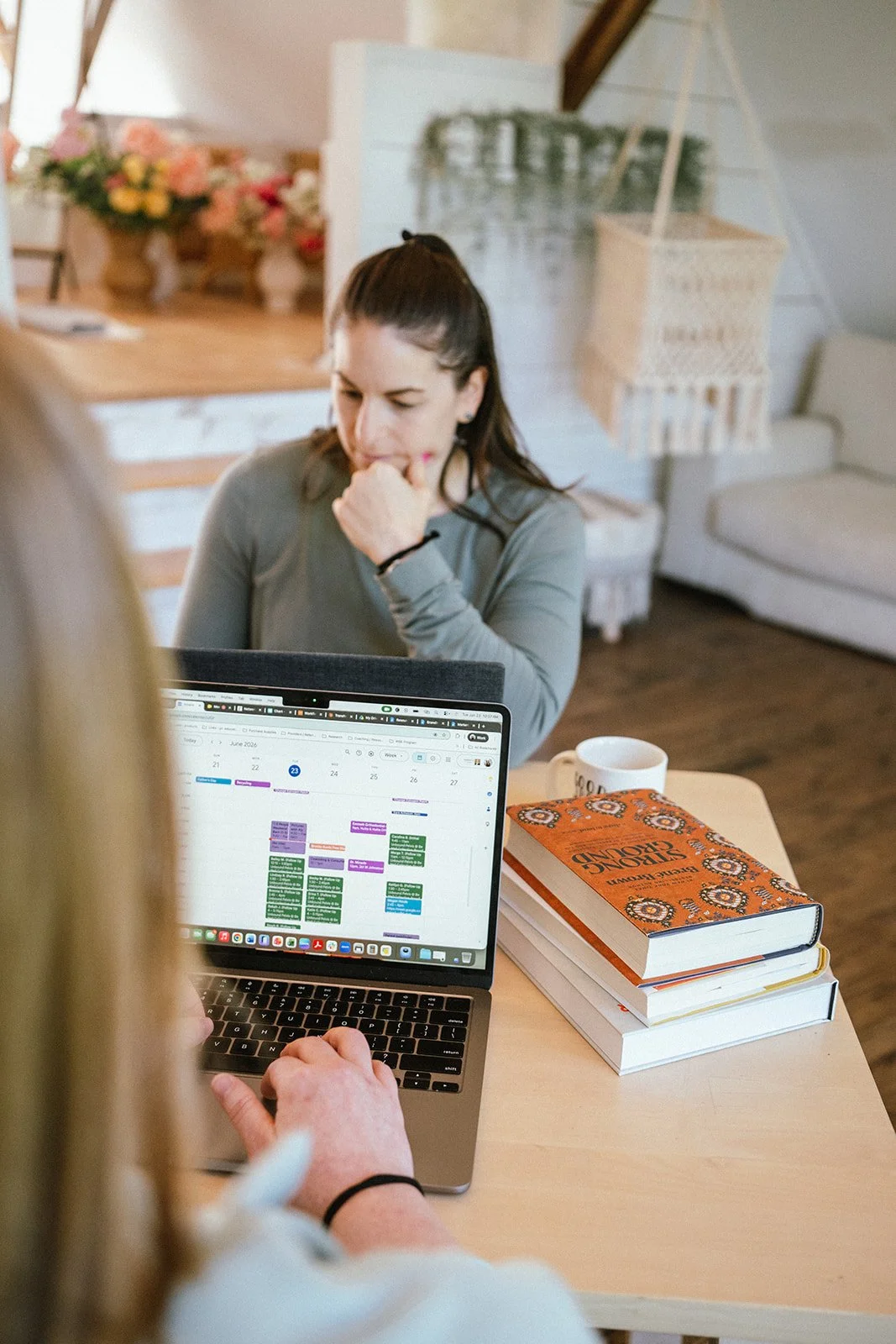 Dr Amanda Townsend working with business consulting client at a desk