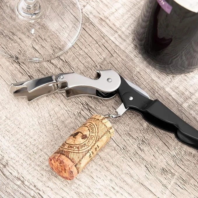 A waiters corkscrew consists of three pieces on a hinge.  The main handle has a cork screw that pops out to go into the cork.  One hinge has two peices that create leverage agains the bottle and the last piece is a small knife
