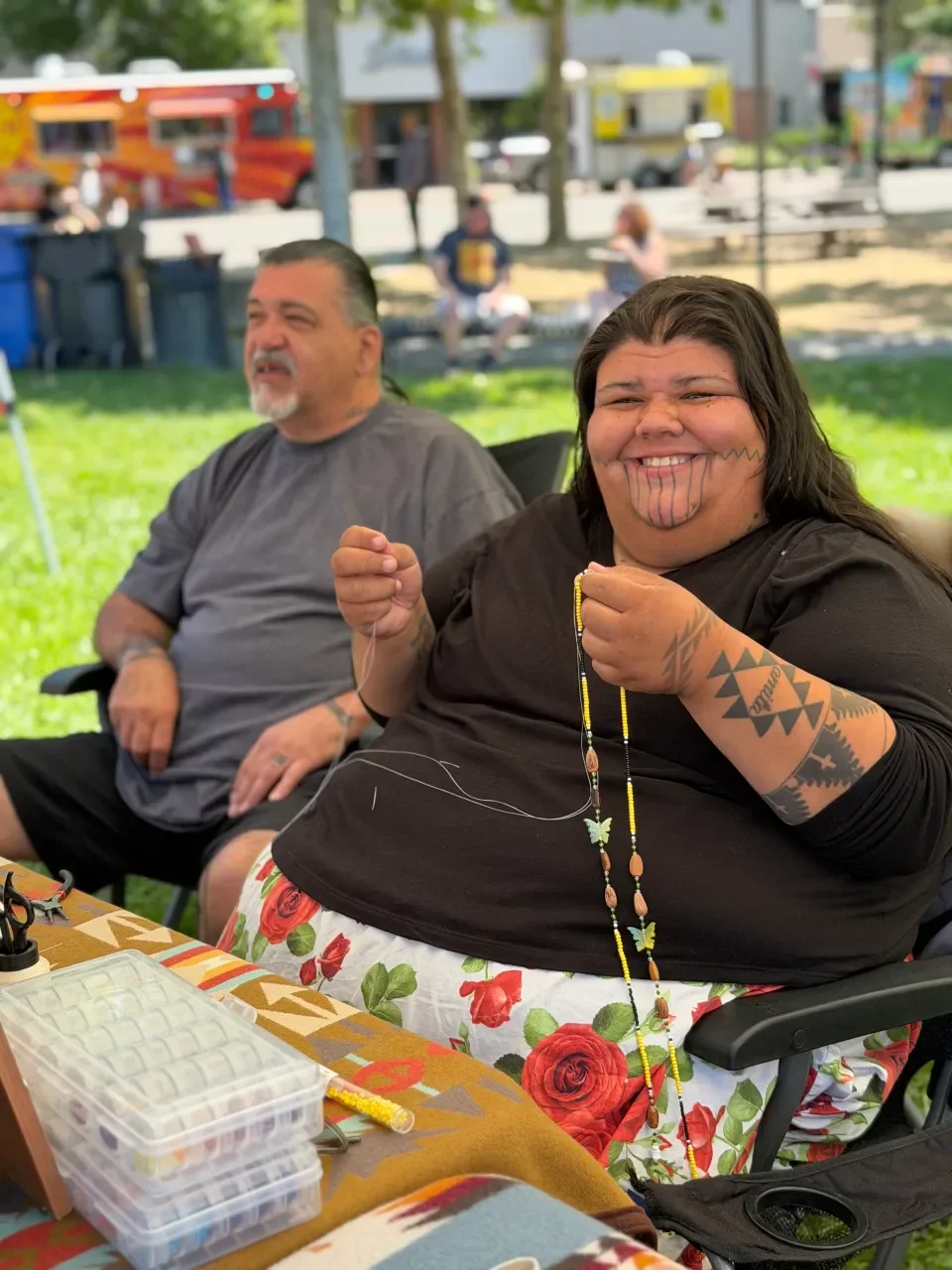 woman-with-tribal-tattoos-beading.webp