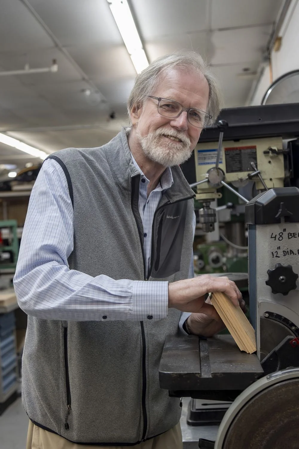 Brian Graham, Ability Workshop board member, working at a drill press in the workshop