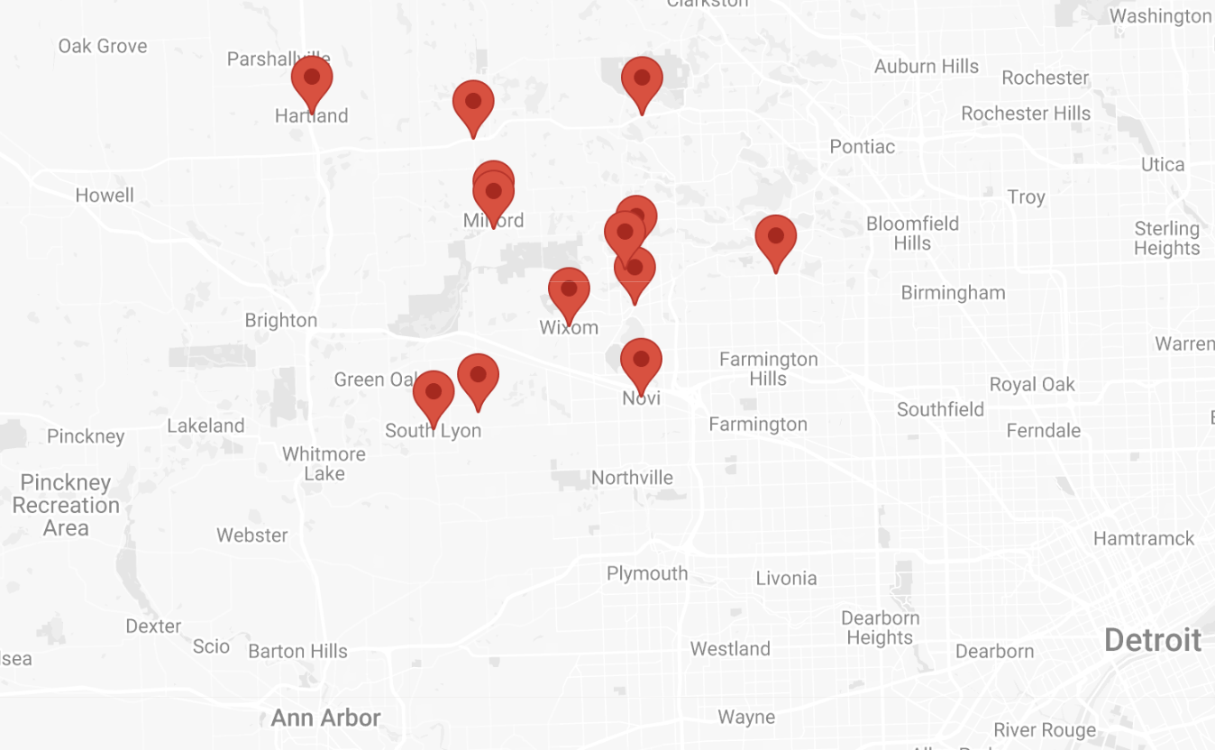 Map of Detroit area with multiple red location markers indicating specific places.