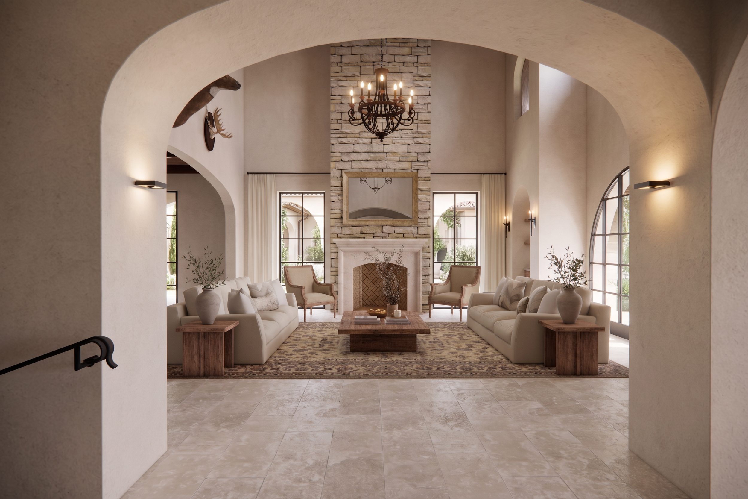 A spacious living room with high vaulted ceilings, a stone fireplace, large windows, and elegant furniture, including sofas and armchairs, decorated with vases and plants.