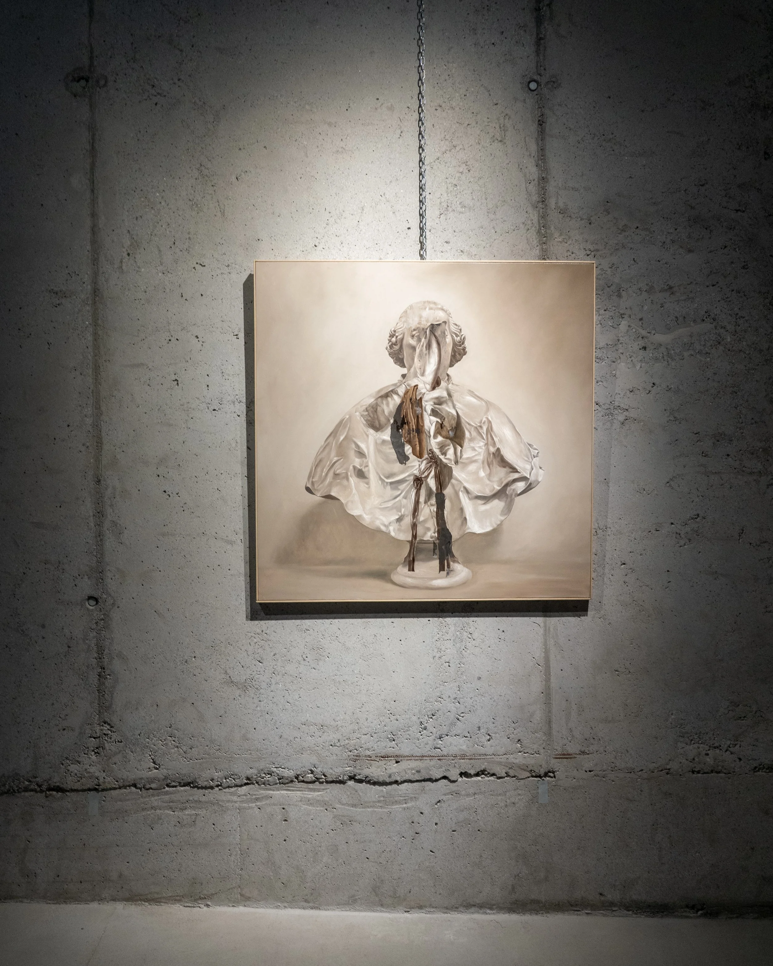 A portrait of a woman in a white dress with volume and ruffles, standing against a neutral background, displayed on a wall with a chain hanging above.