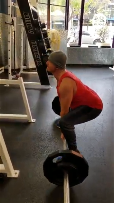 Virtual form check for a client performing a barbell lift, showcasing remote strength coaching by Grateful Strength & Wellness.