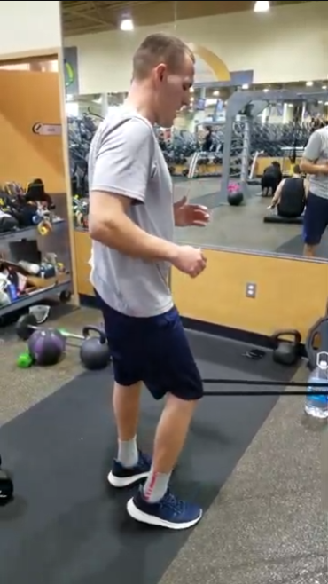 Online coaching client submitting a resistance band workout video for a remote form review by Grateful Strength & Wellness.