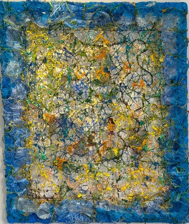 Abstract mixed media painting featuring a textured blue border and a central area with a web of yellow, orange, green, and black lines creating a complex, layered pattern.
