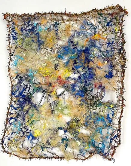Abstract mixed media artwork with a textured, irregular border, featuring a colorful network of cracked, intertwined patterns in shades of blue, yellow, and earth tones.
