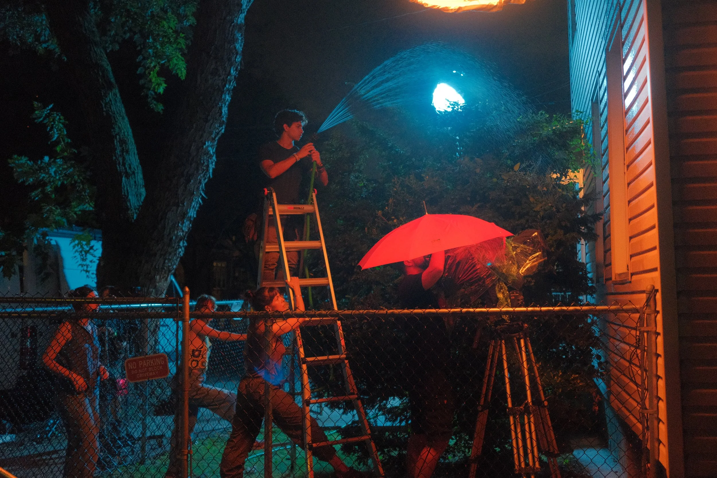 The Betta Fish film crew shooting a night shot and using a water hose to create water for Betta Fish