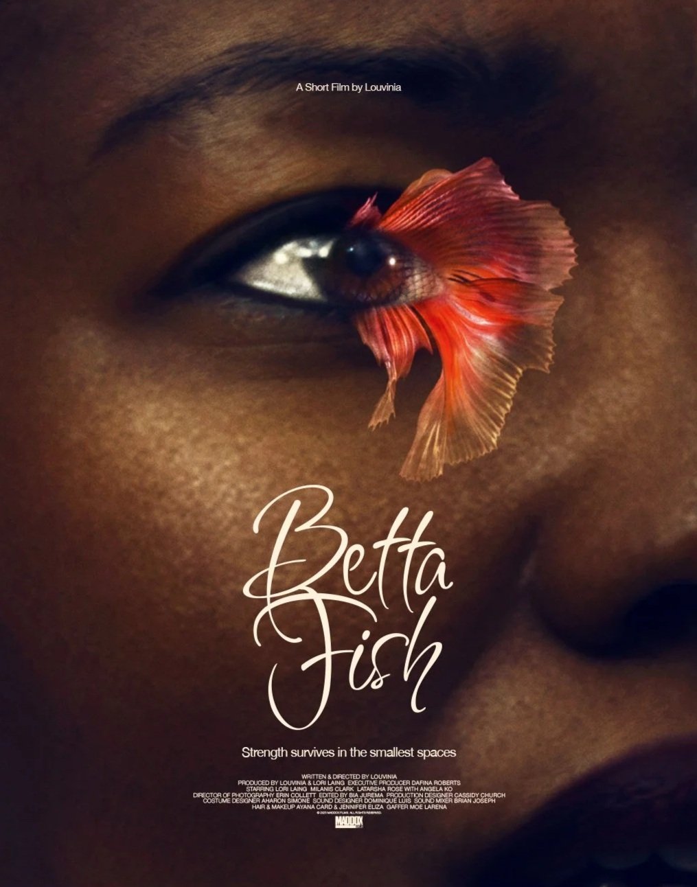 Close-up of a person's face with a large eye. An orange and red betta fish is superimposed over the eye, blending into the eyelid. The text 'Betta Fish' and 'Strength survives in the smallest spaces' is displayed on the image.