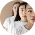Three women standing close together, with faces partially overlapping, gazing forward in a neutral expression.