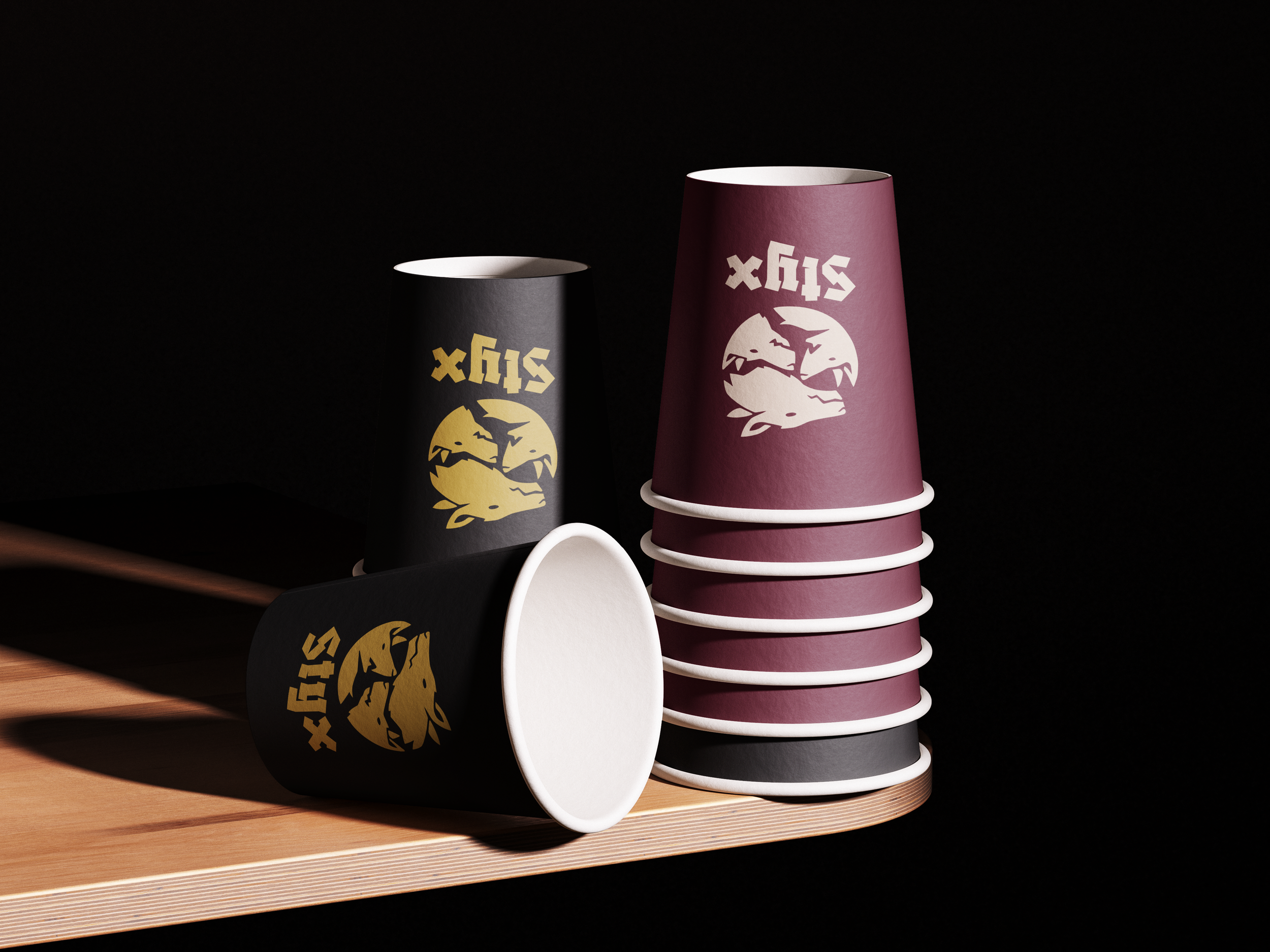 Stack of pink and black cups with a white graphic and the word 'Six' on each, placed on a wooden surface against a dark background.