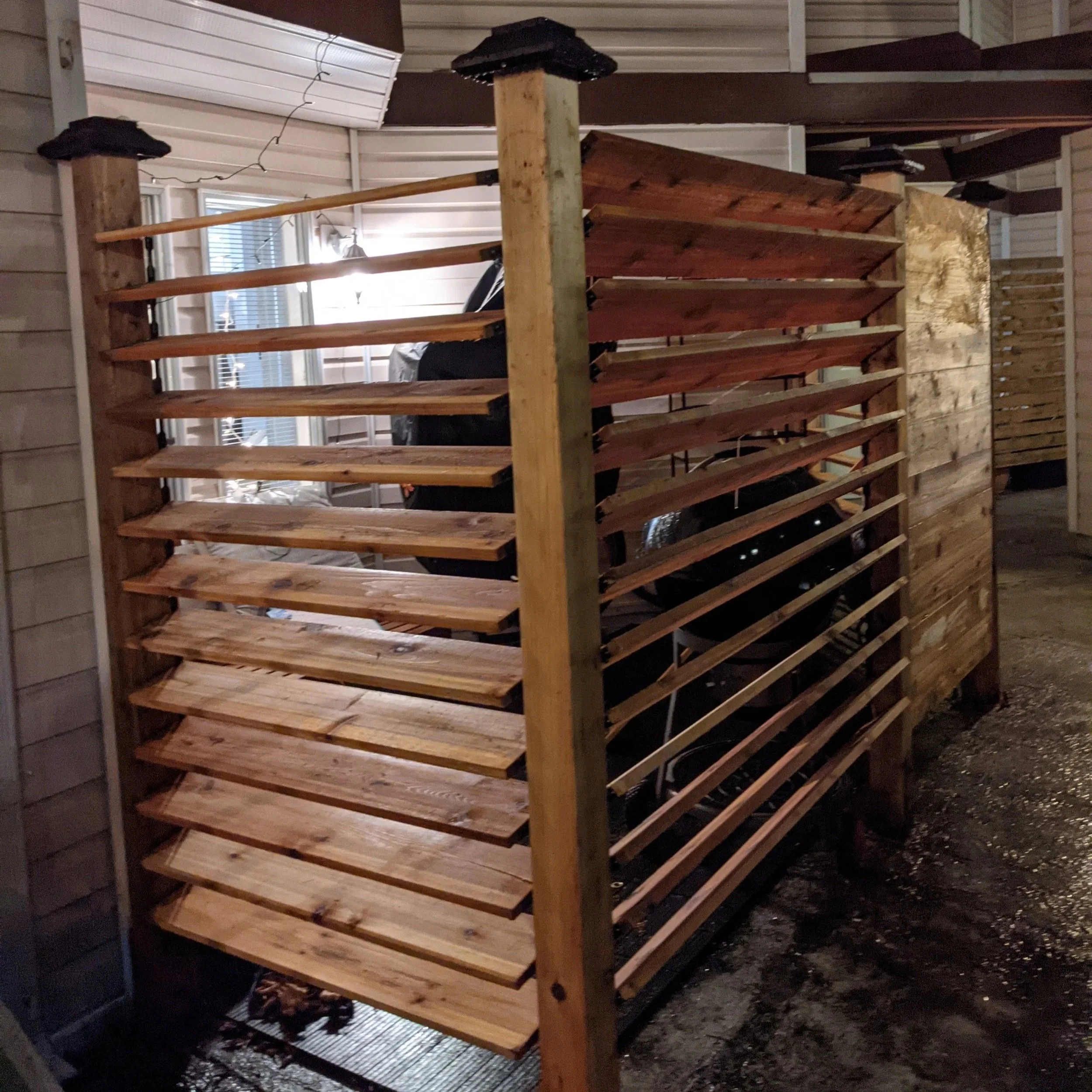 Louvre slat custom wood fence and gate - Vancouver