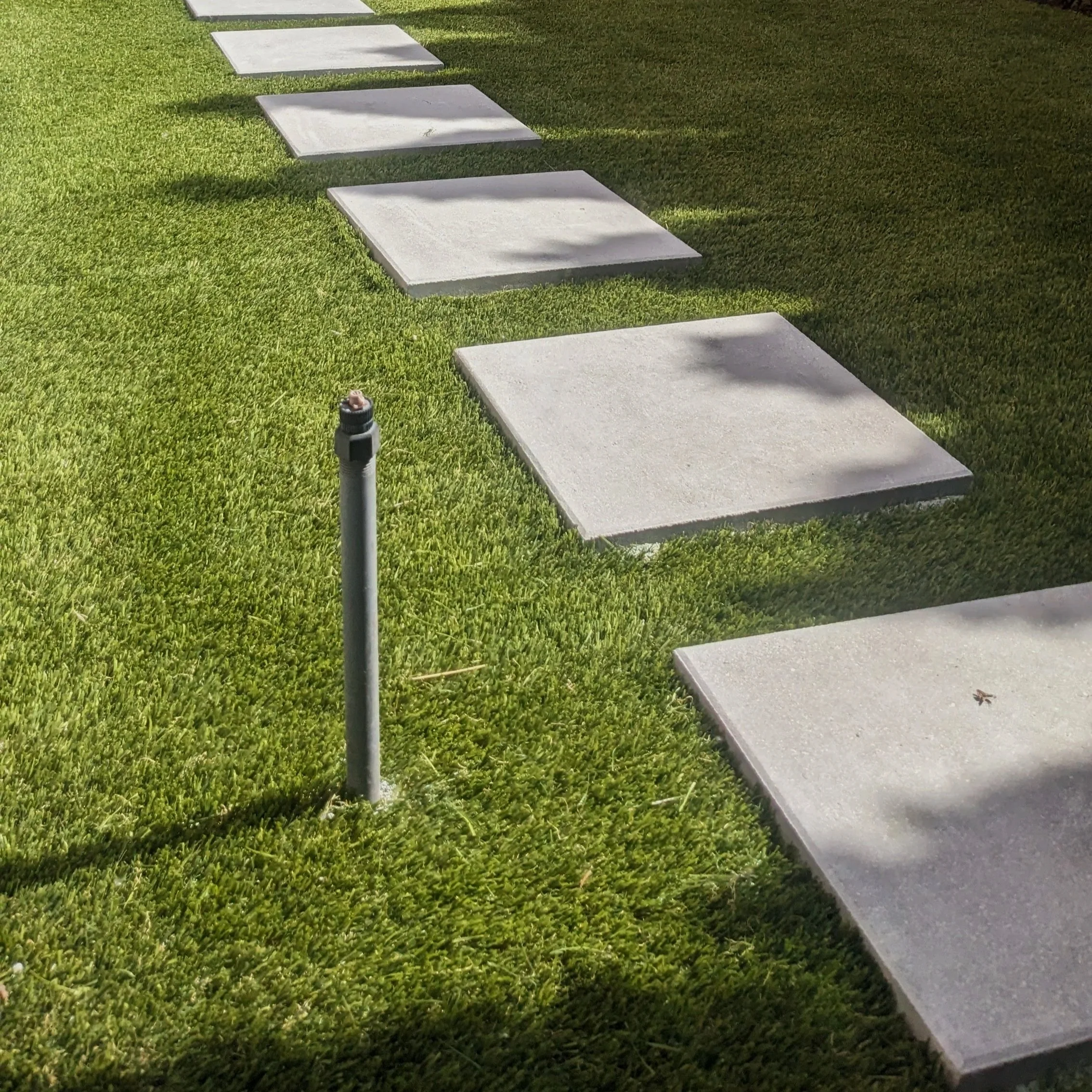 Artificial turf, Newstone Manhattan 24" x 24" concrete slabs - New Westminster 