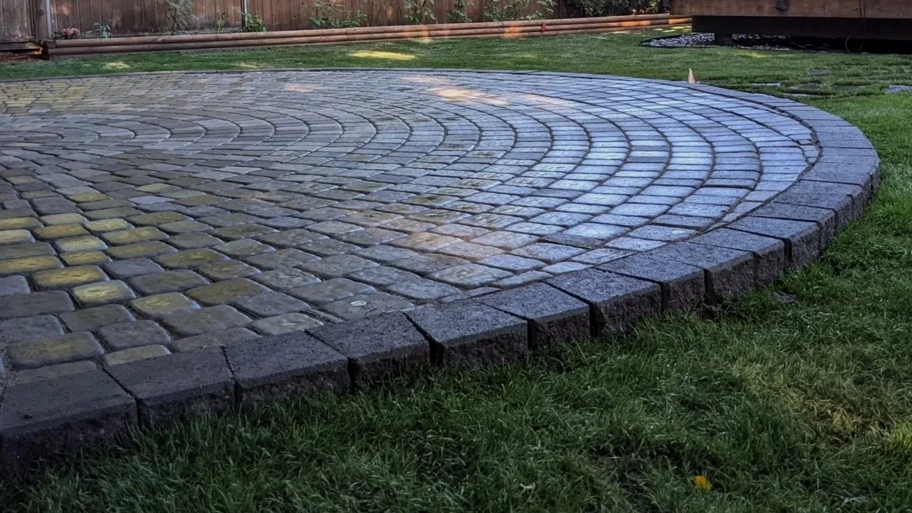 Old Dominion raised paver patio with newly installed sod - Vancouver, BC backyard