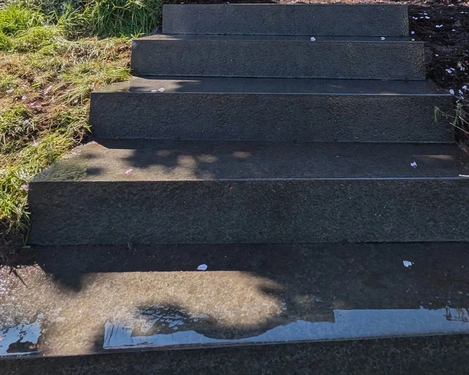 Flamed granite outdoor steps built into a sloped garden - Burnaby front yard