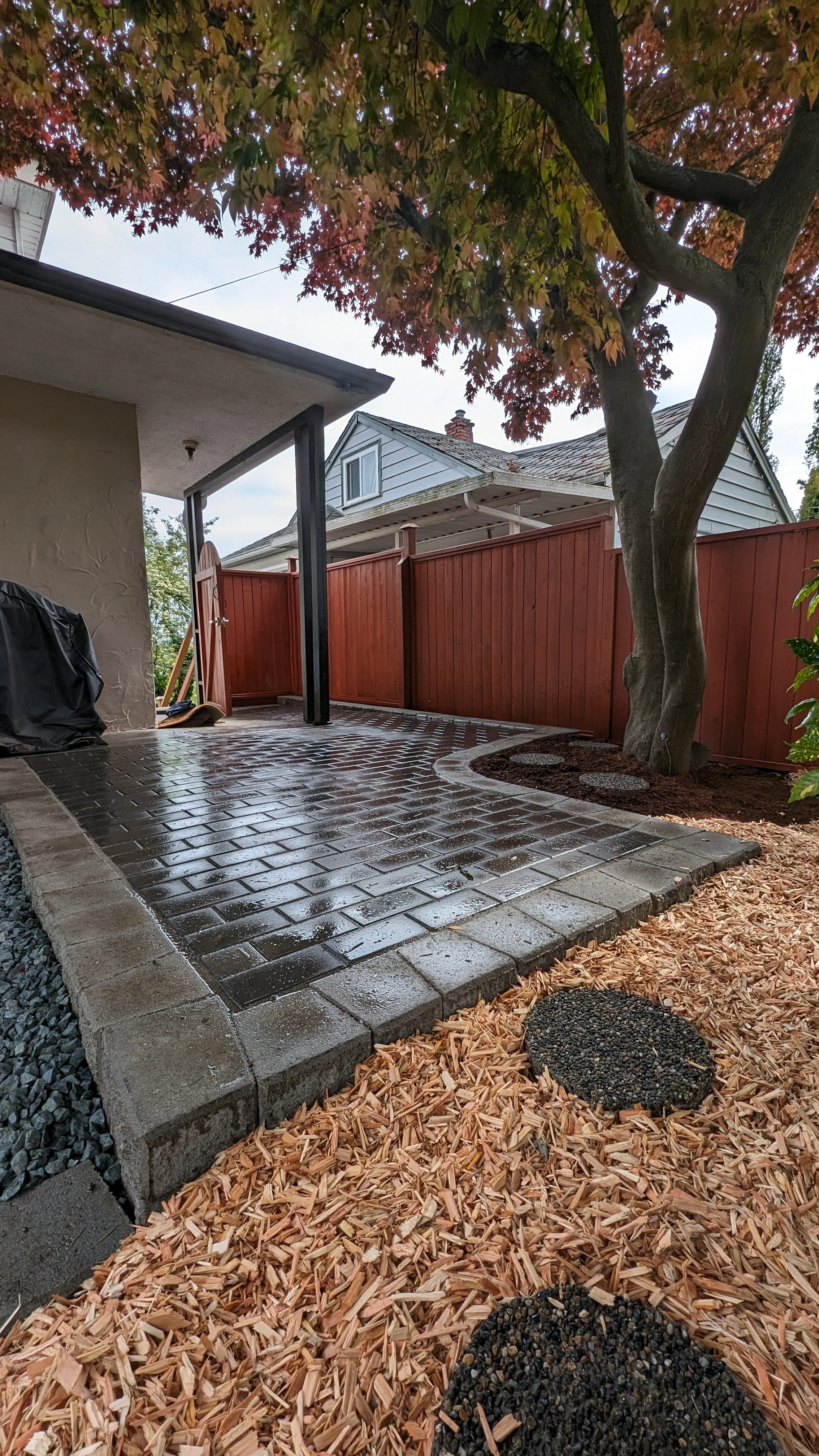 Permeable Newstone Classic Standard Series paver patio, Stackstone retaining wall - New Westminster