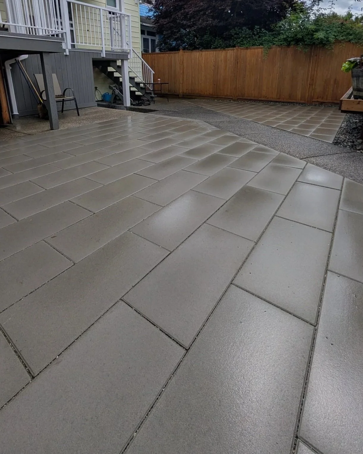 Permeable gray paver slab patio - New Westminster backyard