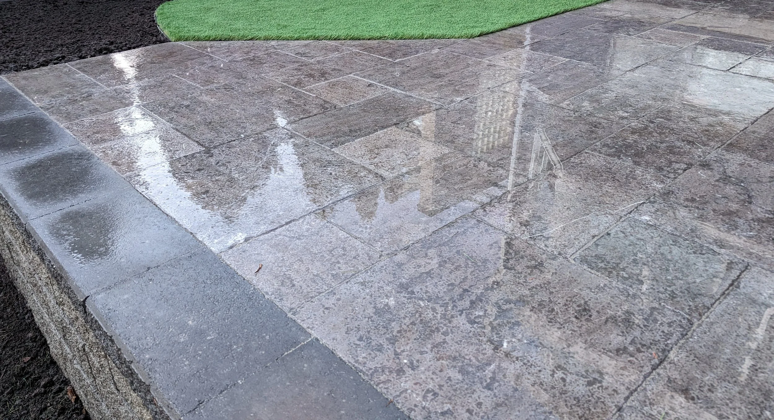 Valley Stone retaining wall, artificial turf and a permeable paver patio - Vancouver