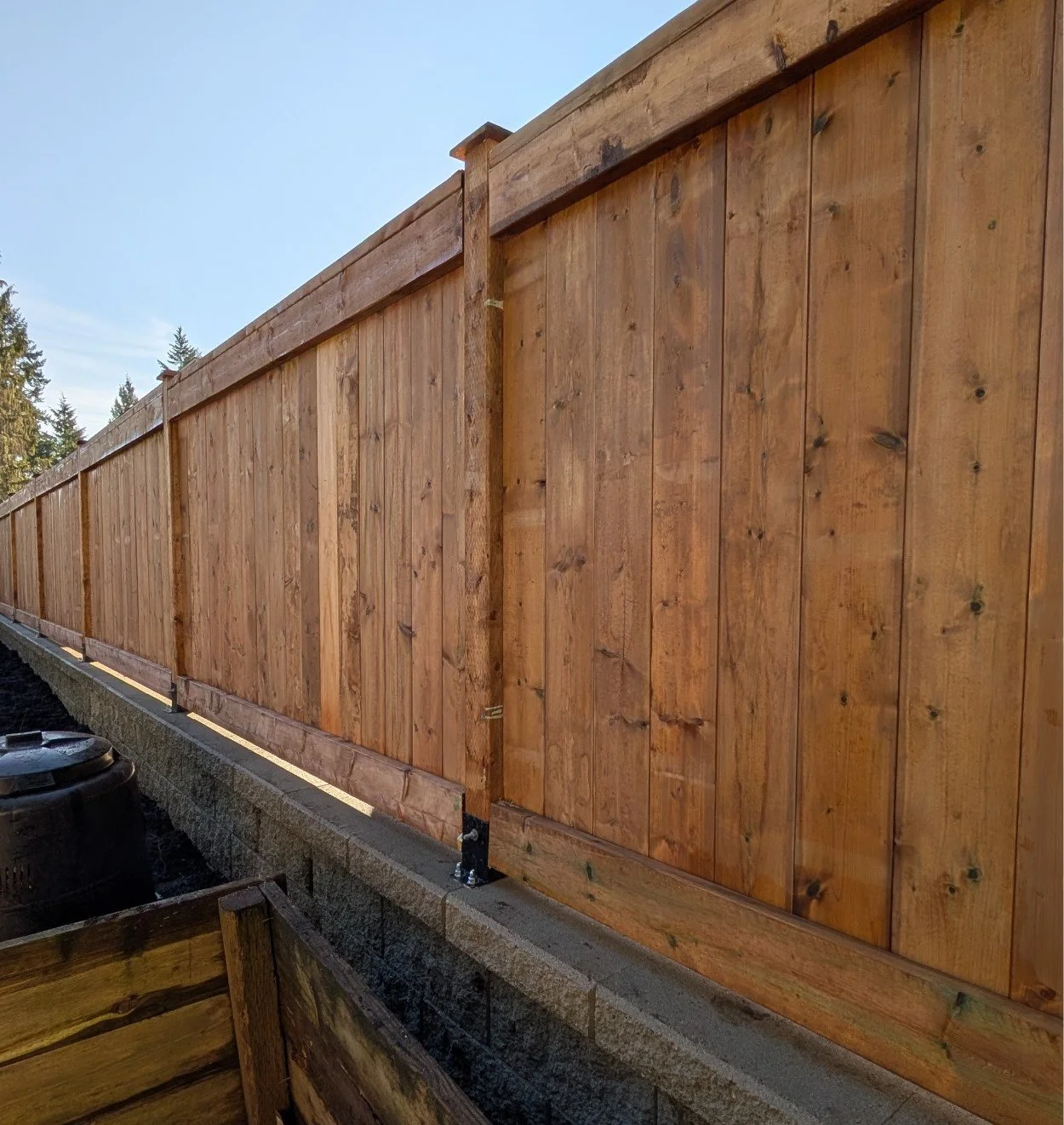 Custom wooden fence, Valley Stone retaining wall - Coquitlam