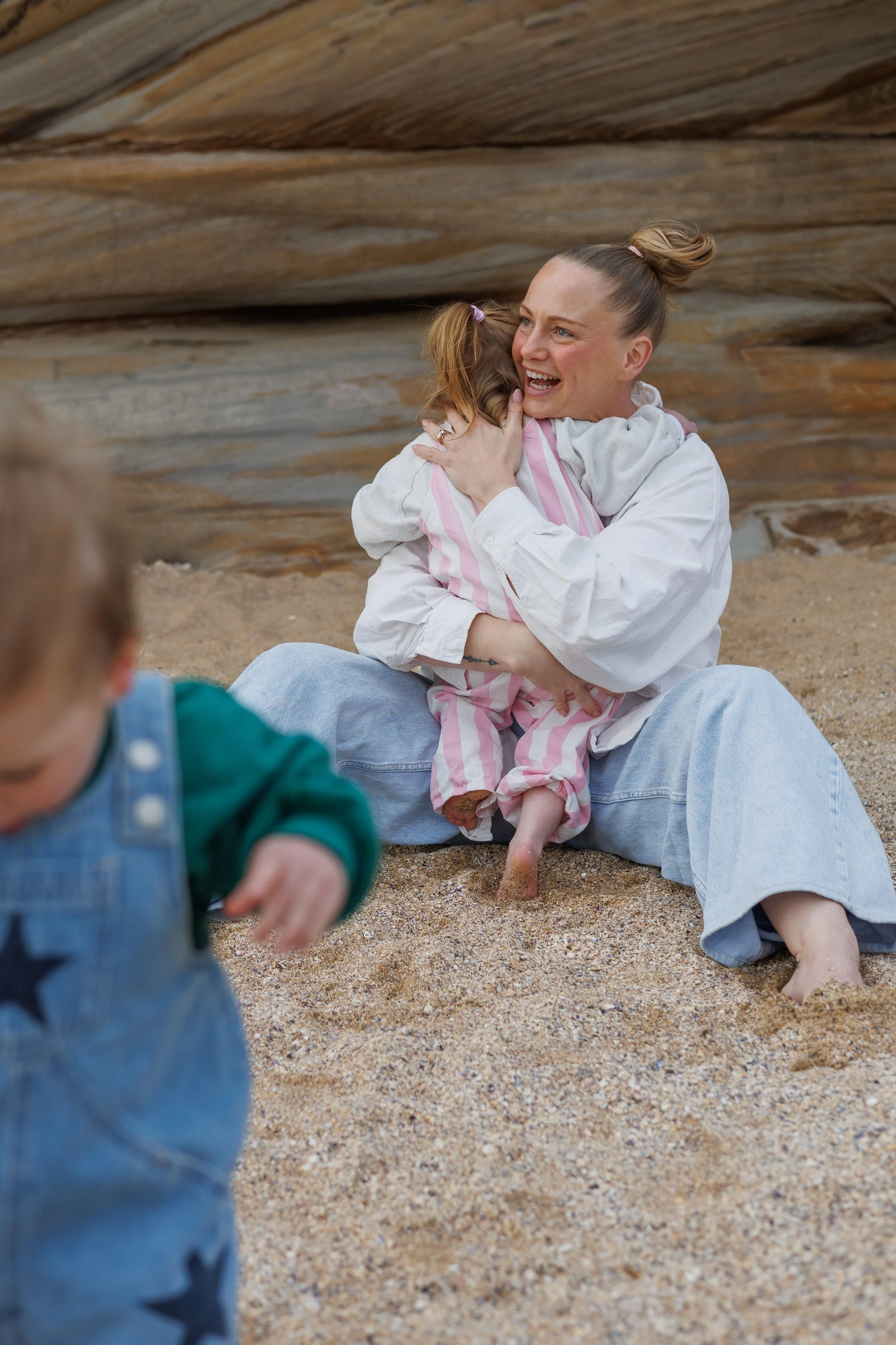 mum and her two kids at the beach