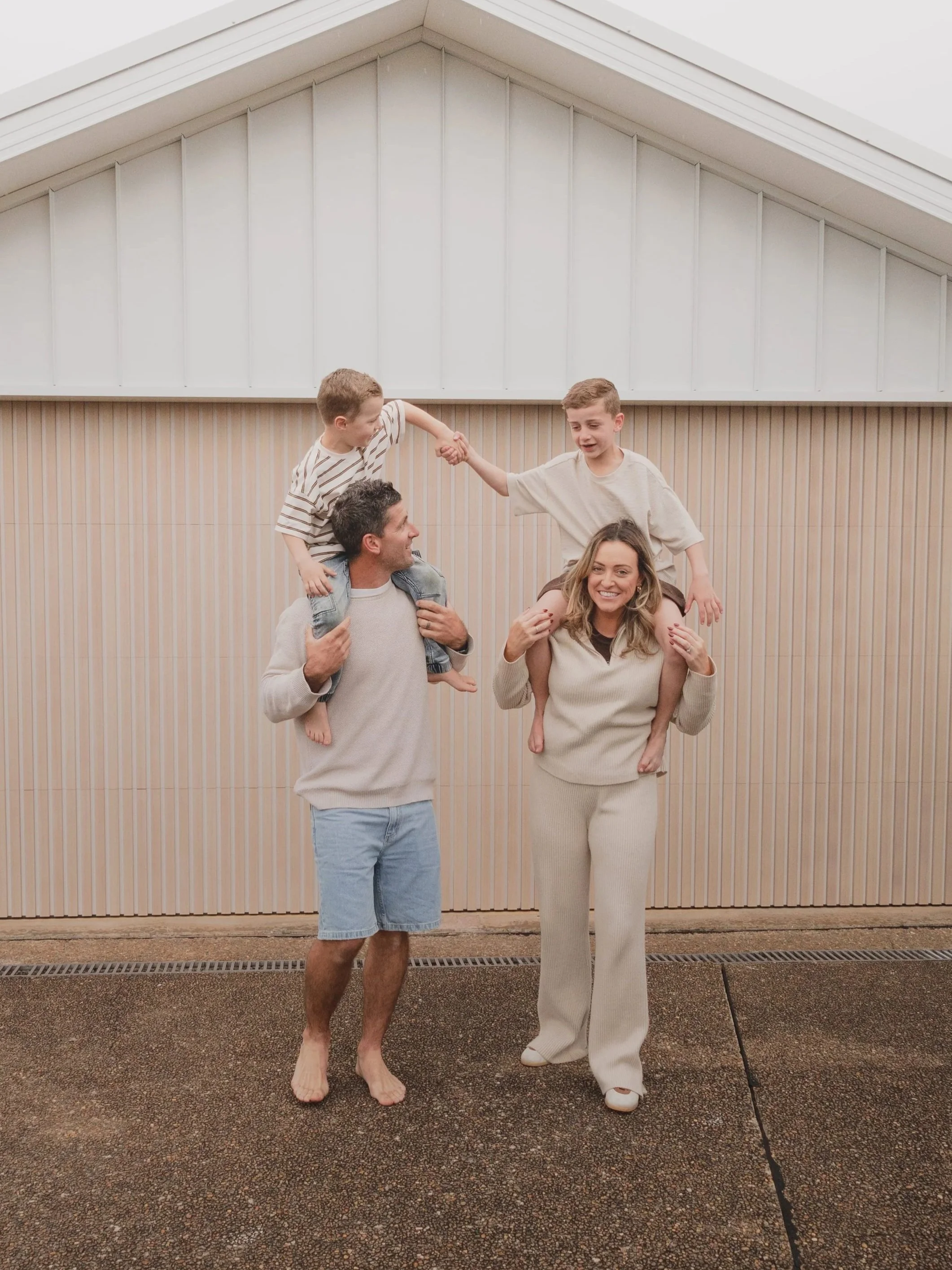 family outside their garage