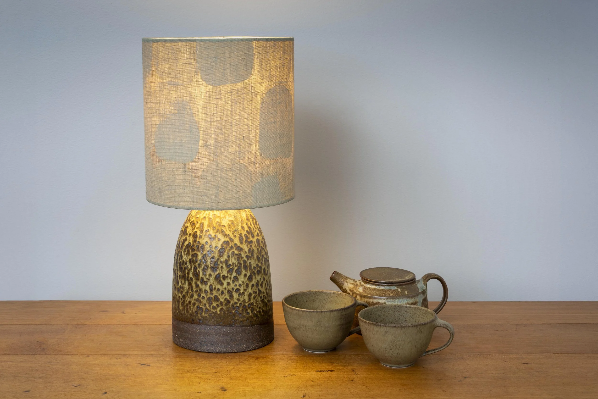 Dark stoneware lamp with linen shade