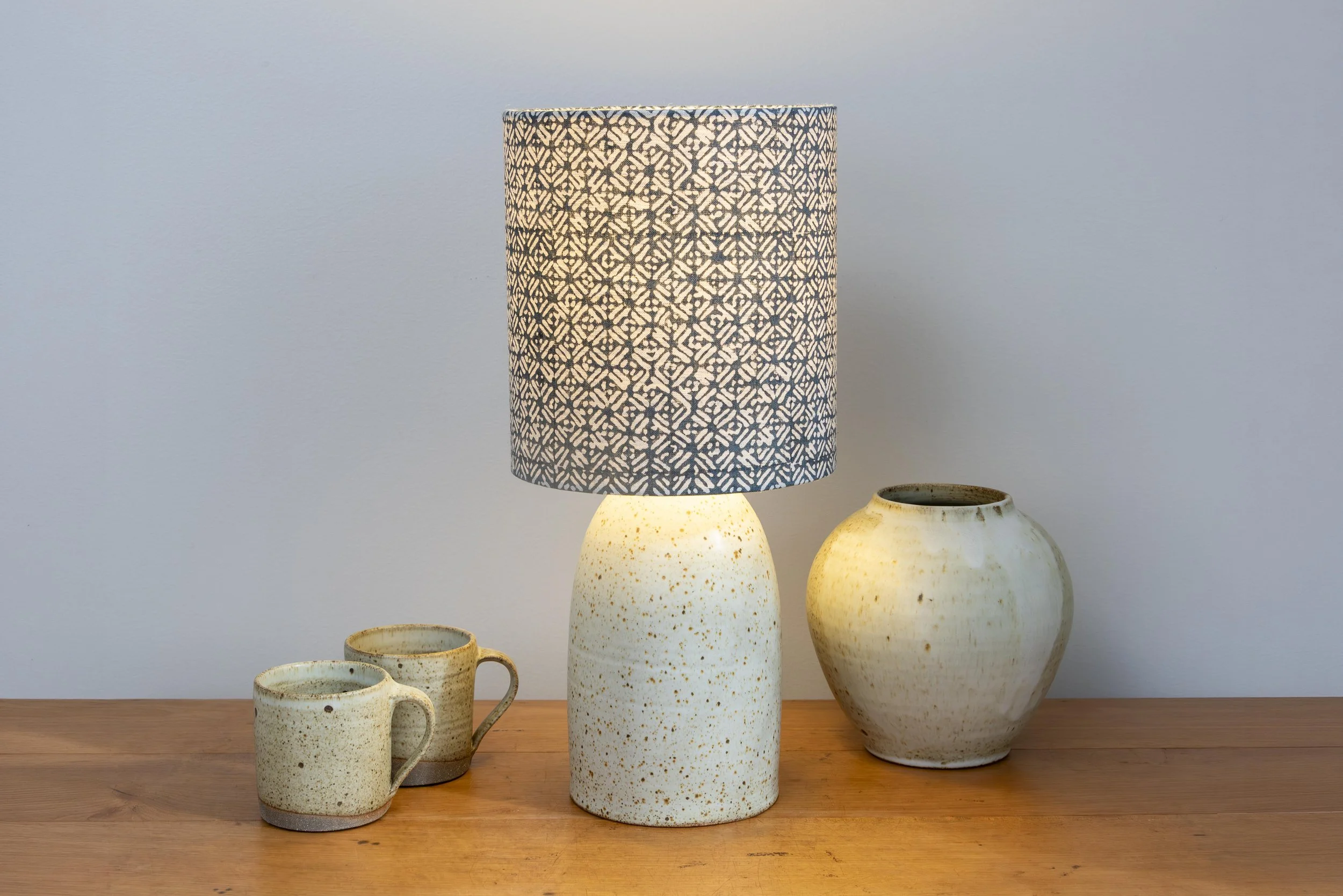 White matt lamp with linen handblocked shade