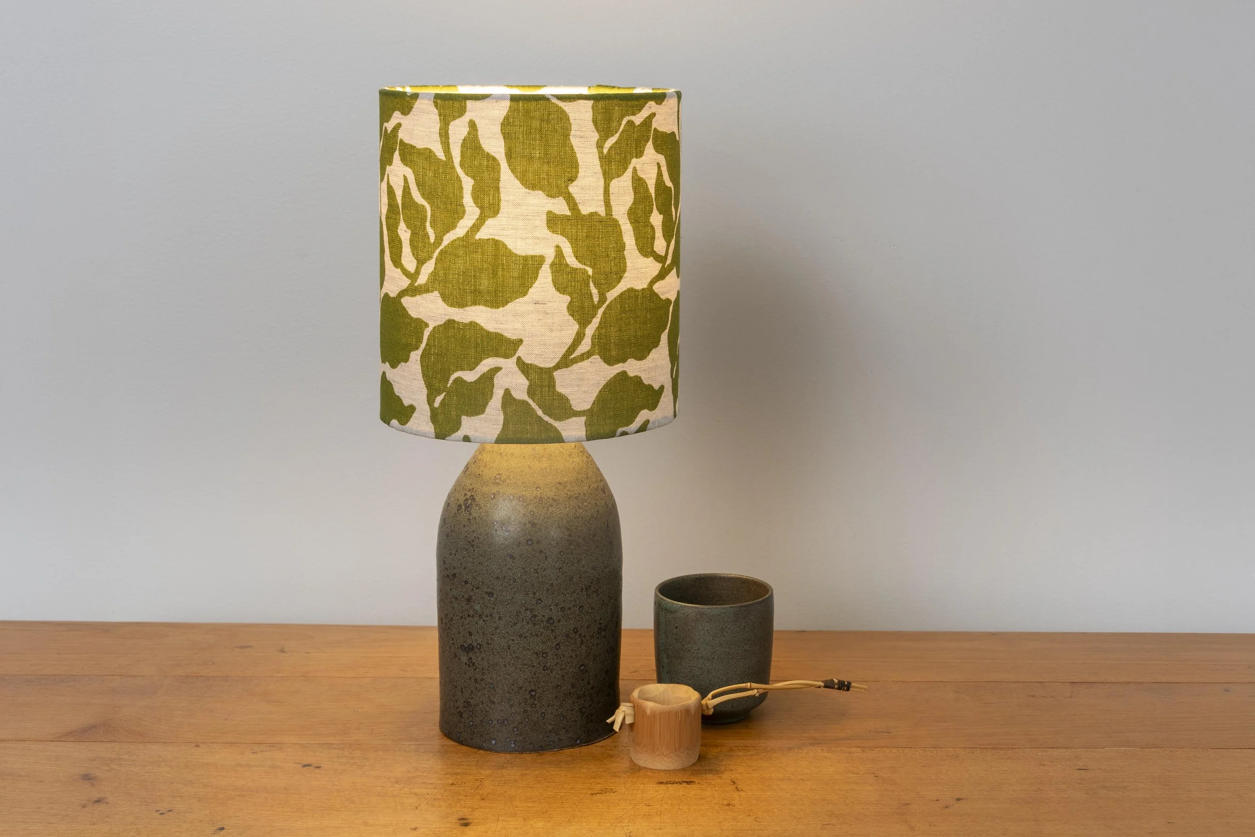 Matt logan green base with chartreuse coloured handblock print linen shade