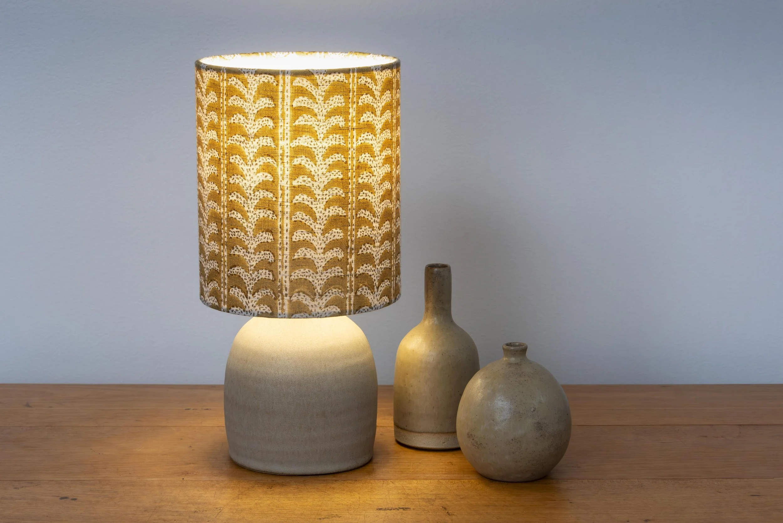 Matt stone glazed base with mustard handblock print linen shade