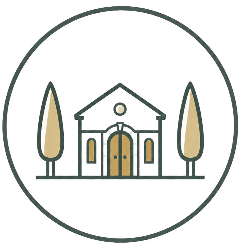 A circular badge featuring a house with a triangular roof, four windows, a large arched door, and two tall, narrow trees on either side.