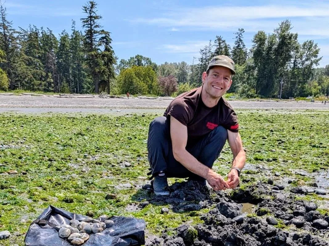 A man digs for butter clams at Birch Bay State Park