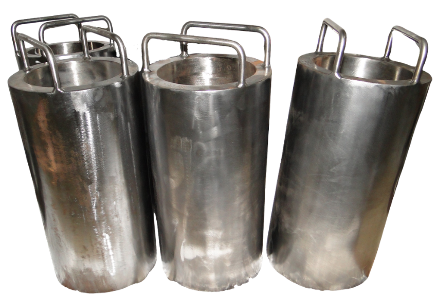 Three large stainless steel cylindrical containers with handles on top, likely used for industrial or food storage purposes.
