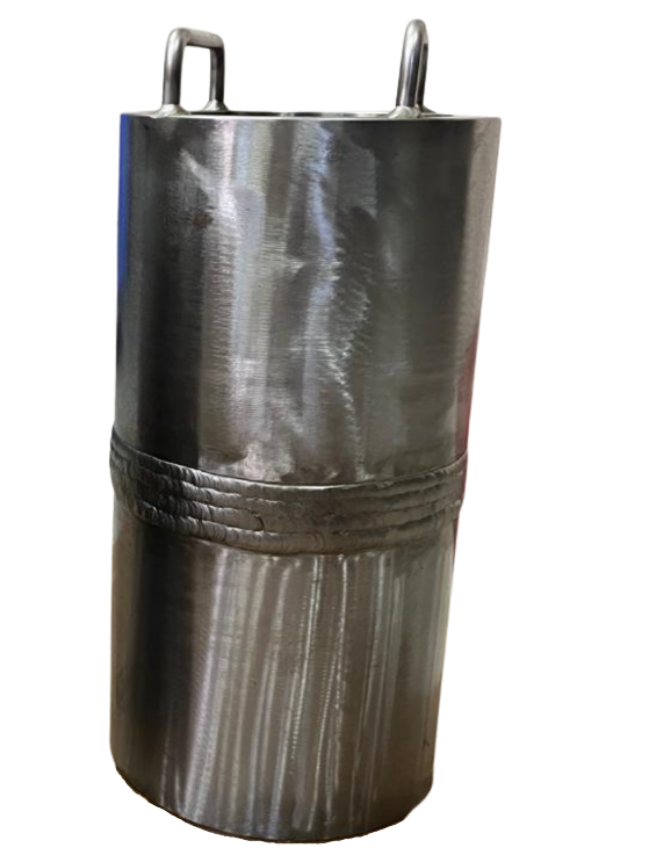 A cylindrical metallic object with handles on top and a band around the middle, possibly a piece of industrial equipment or a container.