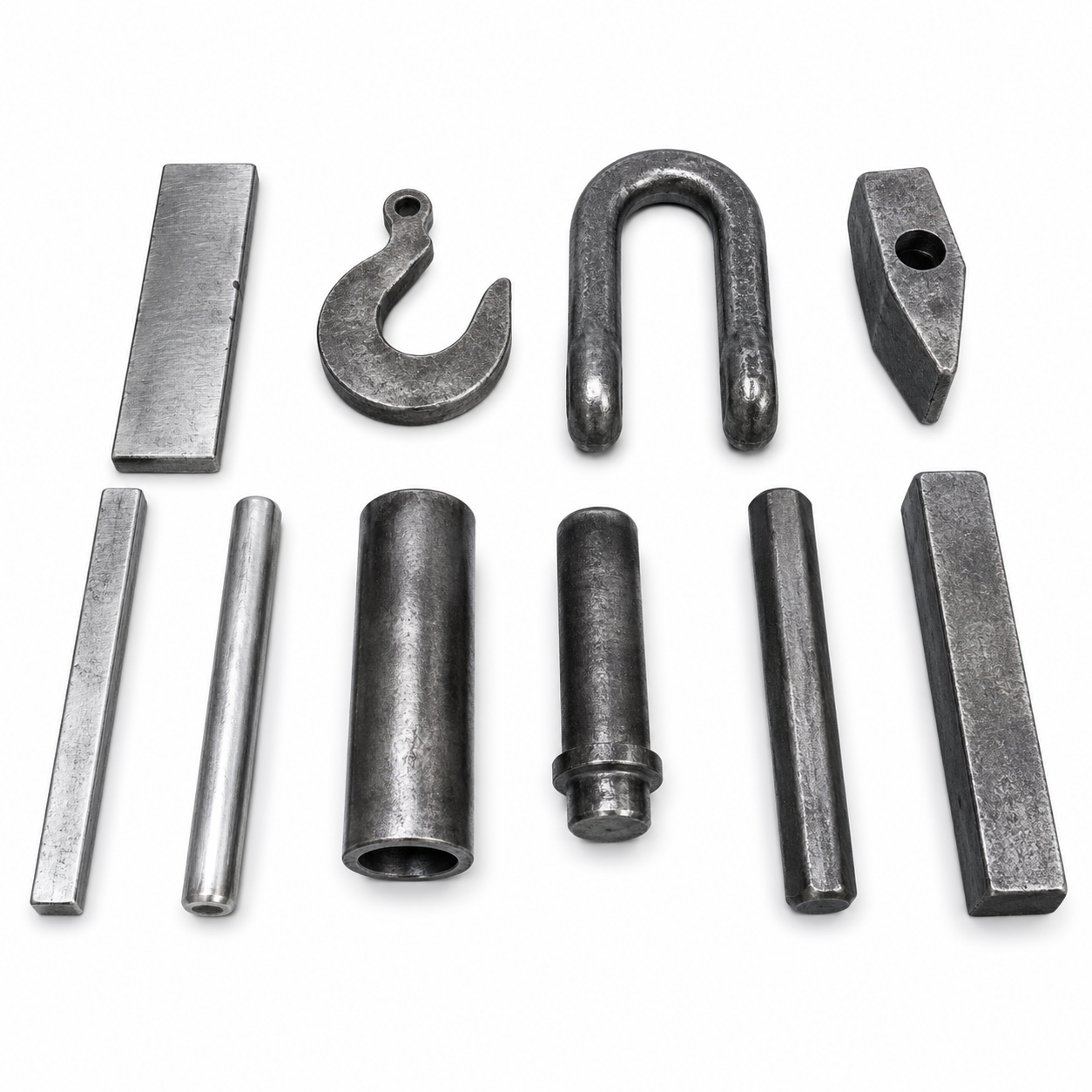 A collection of various metal tools and hardware parts laid out on a white background.