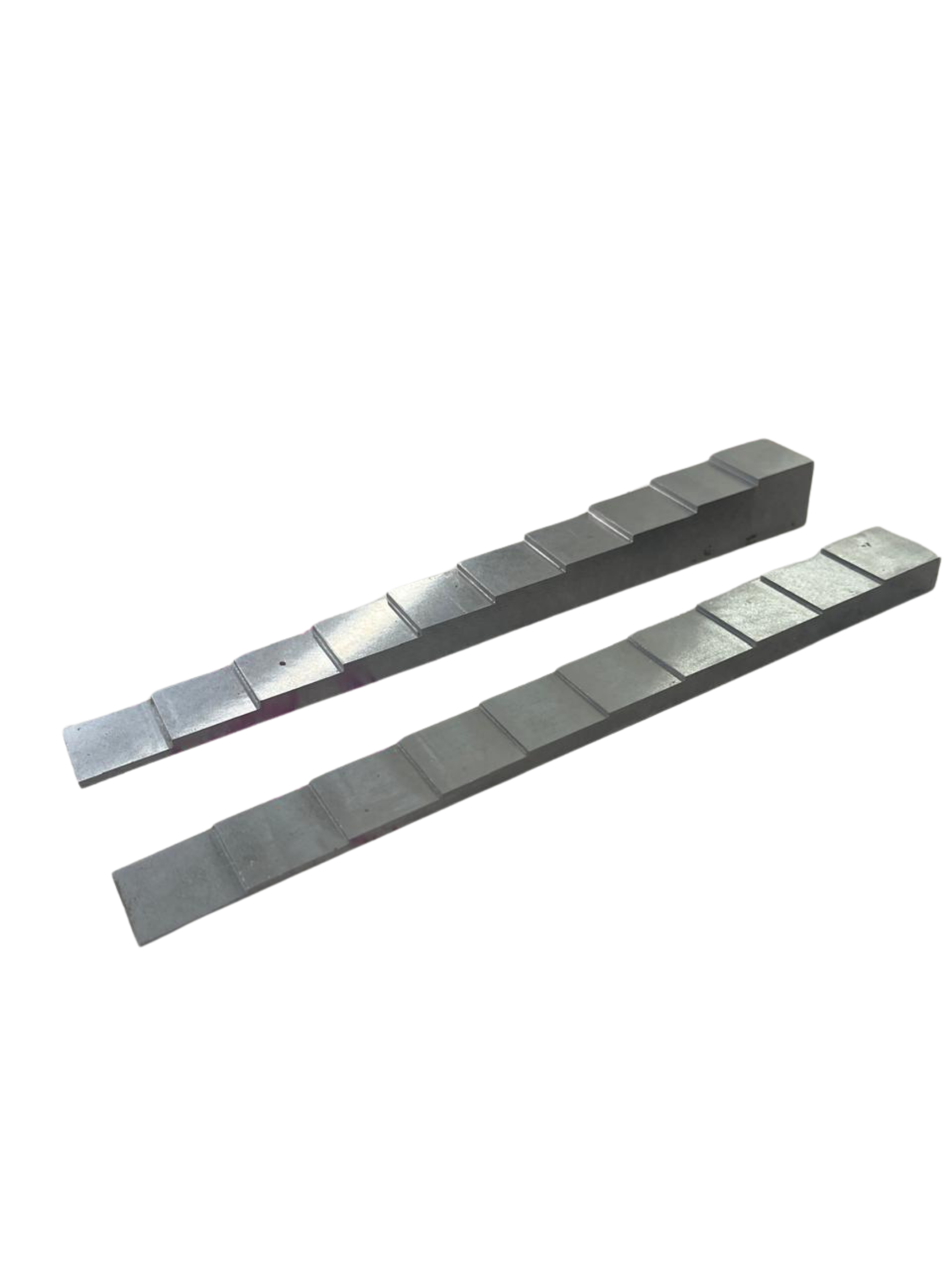 Close-up of metallic stereo or DJ equipment faders or sliders on a white background.