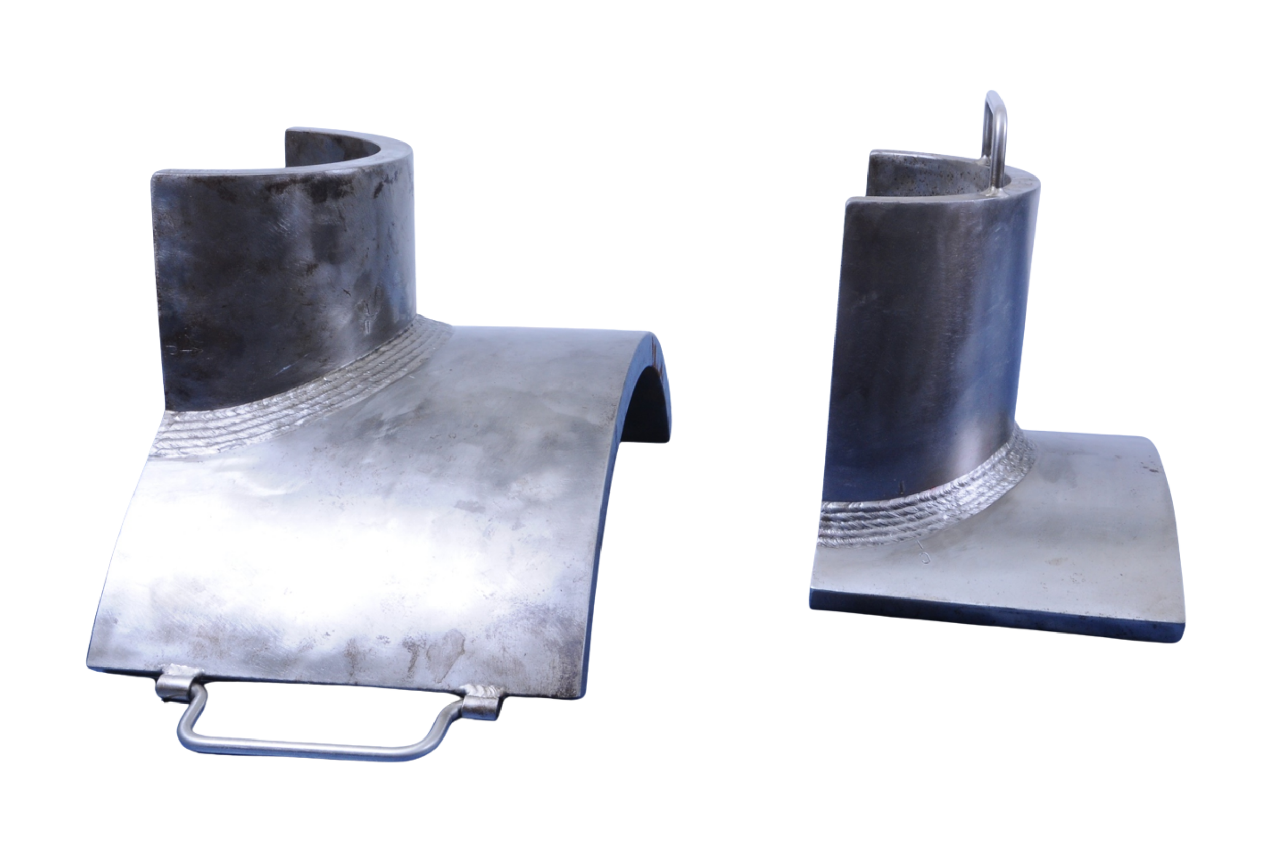 Two metal sheeting seamed pieces, possibly parts of a machine or equipment, with rounded edges and handles, on a white background.