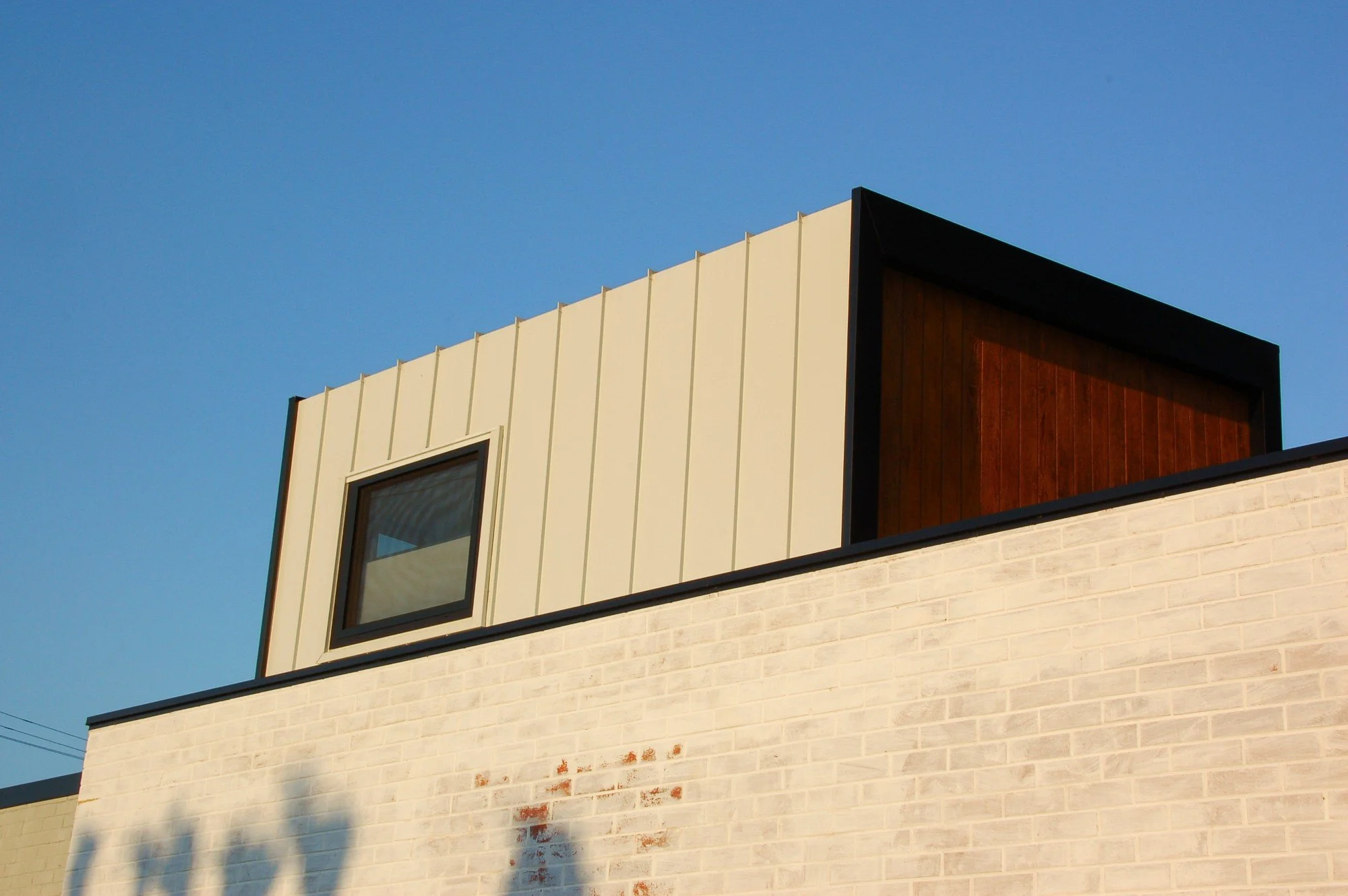 Compact ancillary dwelling in Hamilton Hill, WA, designed across two levels to maximise space. Timber cladding, integrated joinery and thoughtful planning create a warm, functional, sustainable, and contemporary small home.
