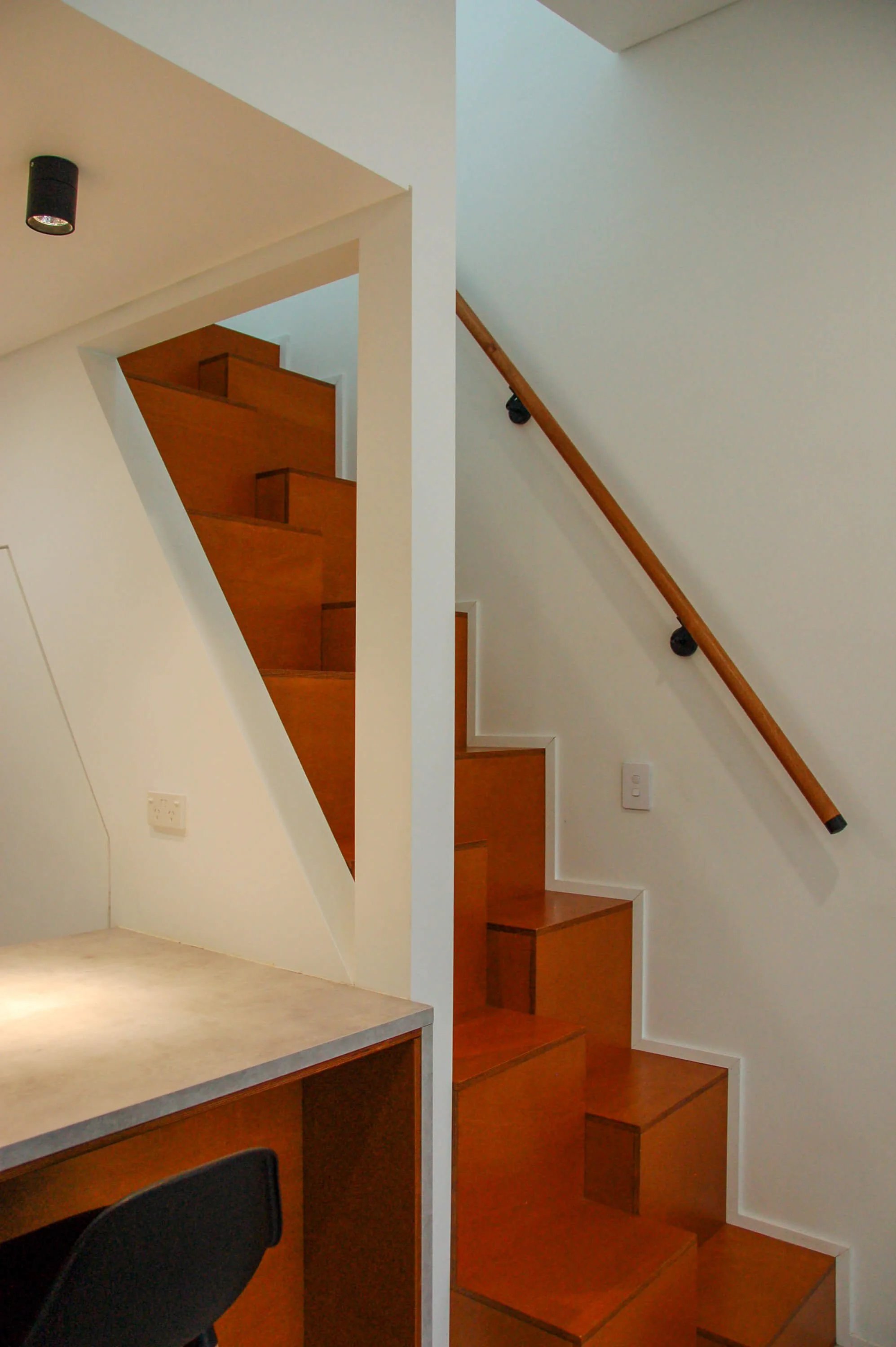 Custom timber staircase and compact interior detailing in a Terra Design Lab residential project in Hamilton Hill