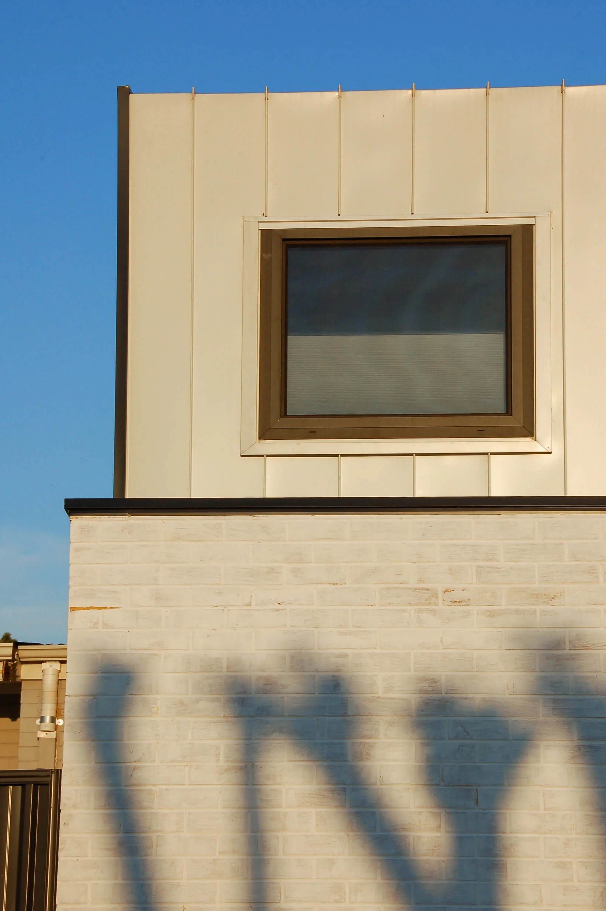 Upper-level window detail on contemporary ancillary dwelling in Hamilton Hill, Fremantle