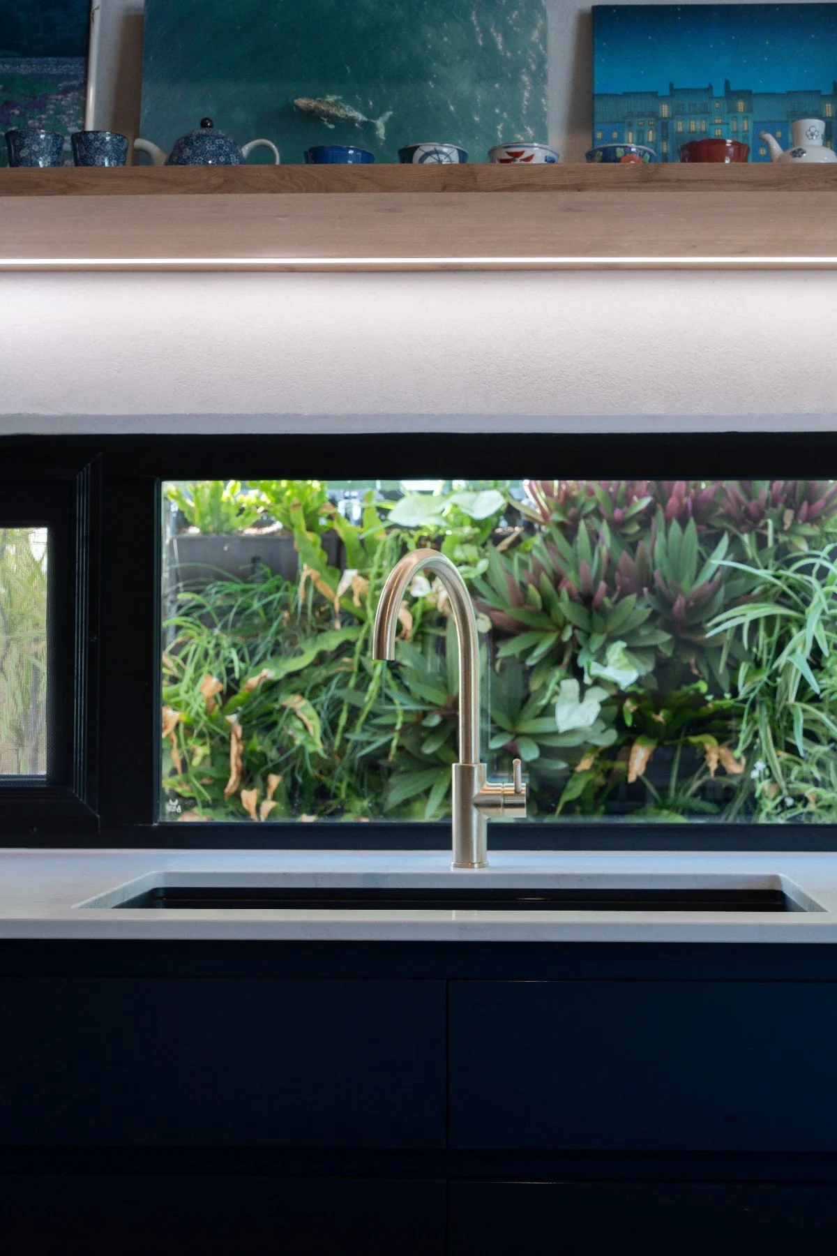 Kitchen window overlooking greenery in contemporary hempcrete home in Nedlands, Perth