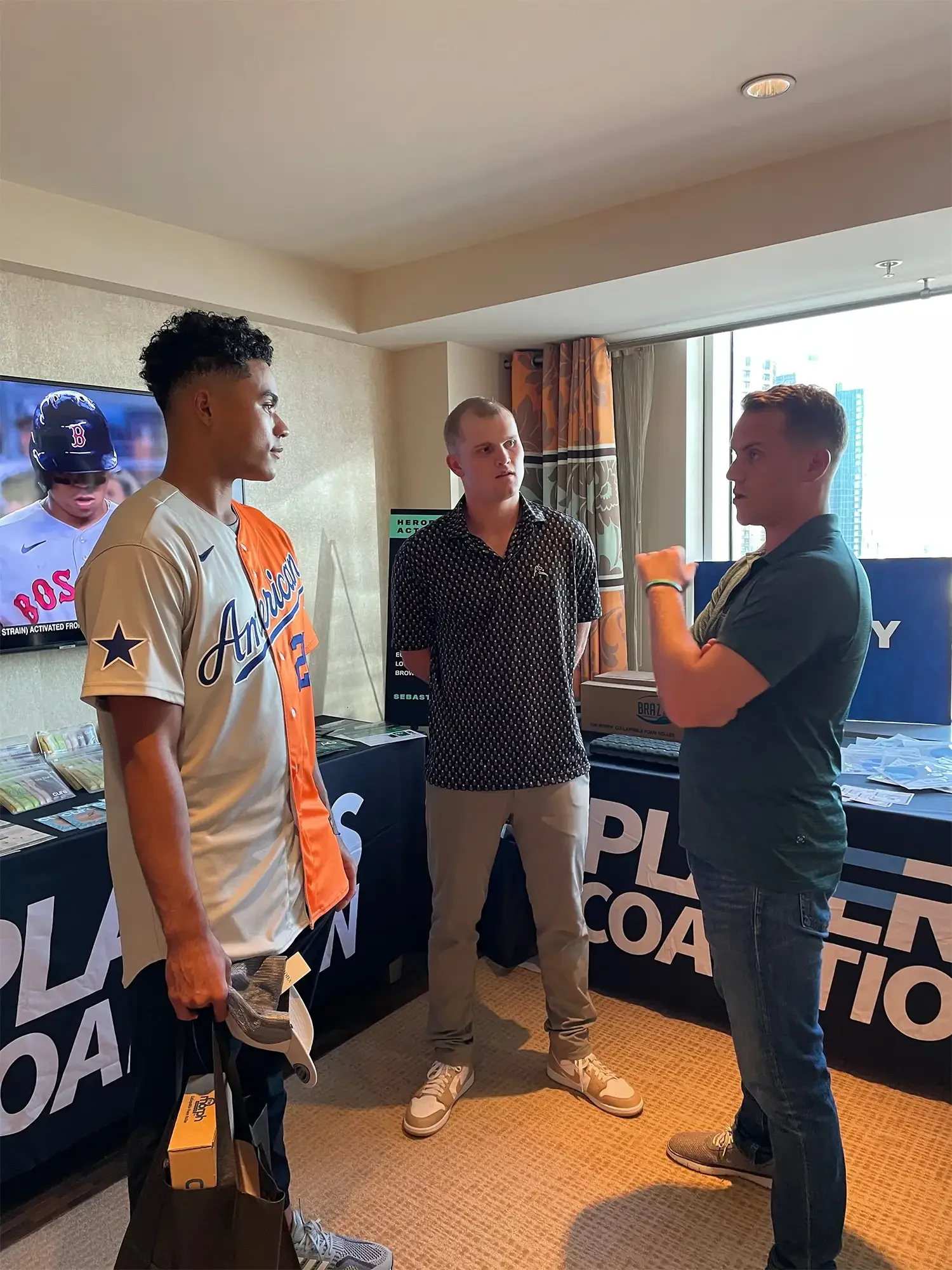 Harry speaking with two minor league baseball players in Los Angeles, CA. Summer 2022.