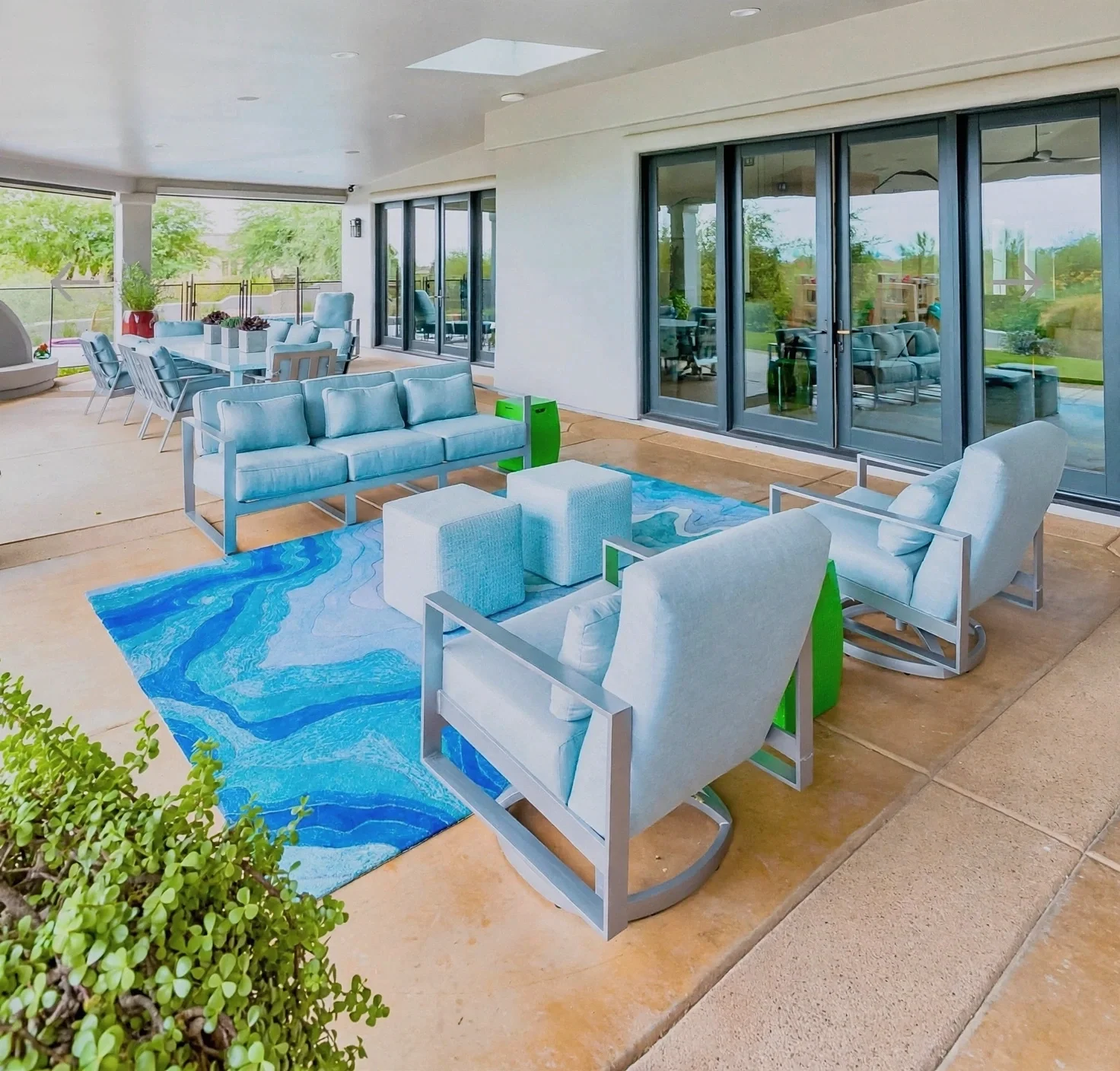 Covered outdoor living area with aqua seating and desert views at DC Ranch in North Scottsdale