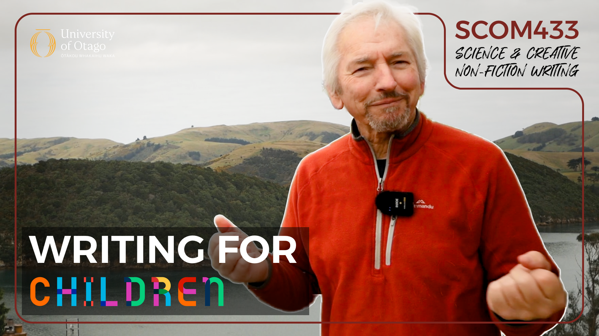 A man in an orange jacket standing outdoors with a lake and green hills in the background, holding a microphone and smiling. The image is part of a promotional banner for a course titled 'Writing for Children,' affiliated with the University of Otago.