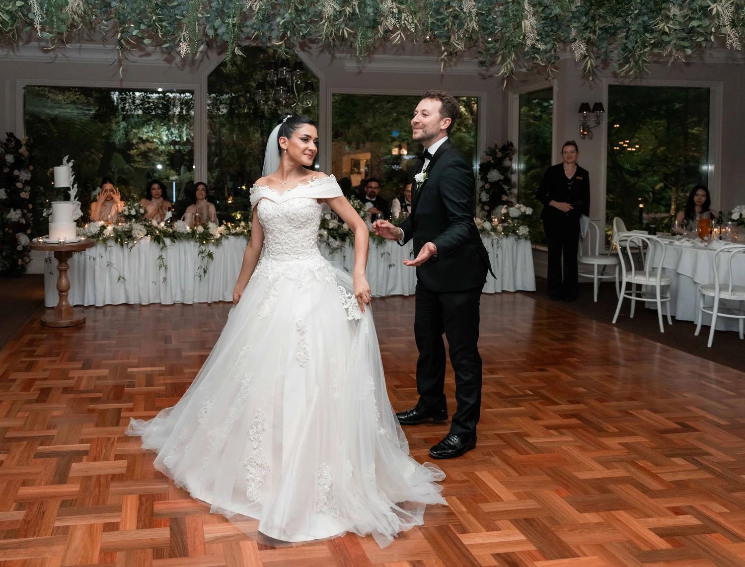 A bride and groom dancing closely at their Melbourne wedding reception.